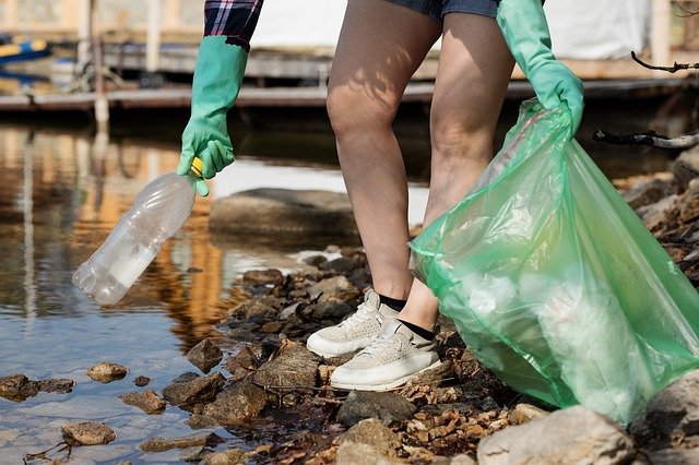 earth day take care person picking stuff up