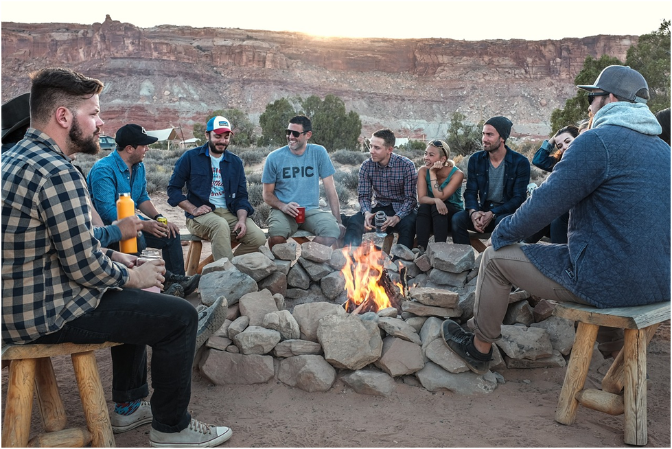 Friendship: How Strong A group of women and men sitting around a fire pit 