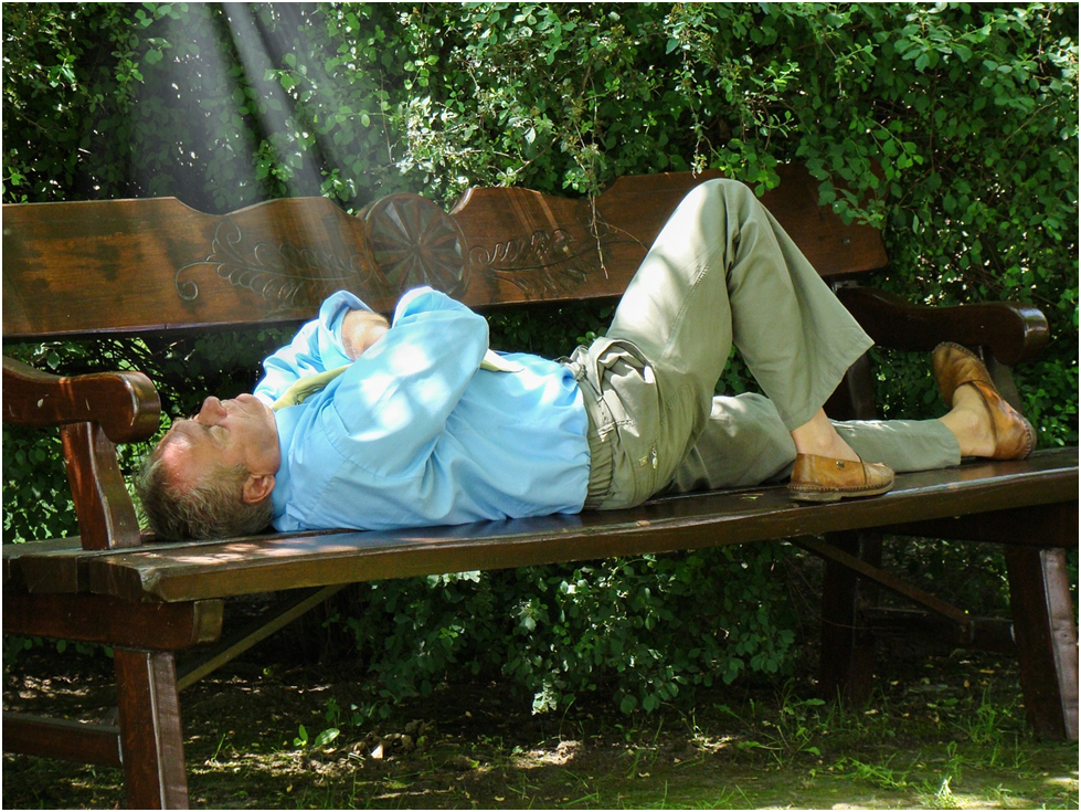 GIFT OF REST MAN SLEEPING ON A BENCH