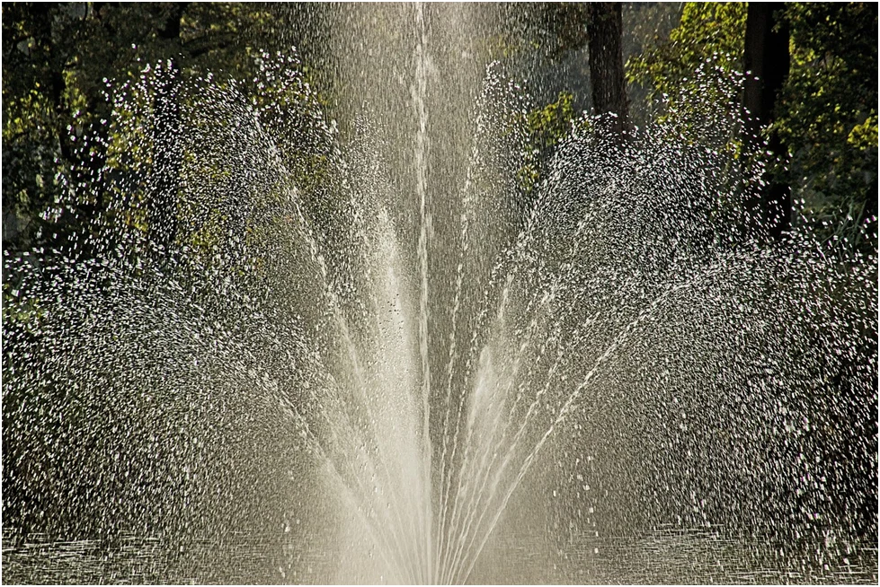 When Life Pours Down Fountain Spewing Water In The Air
